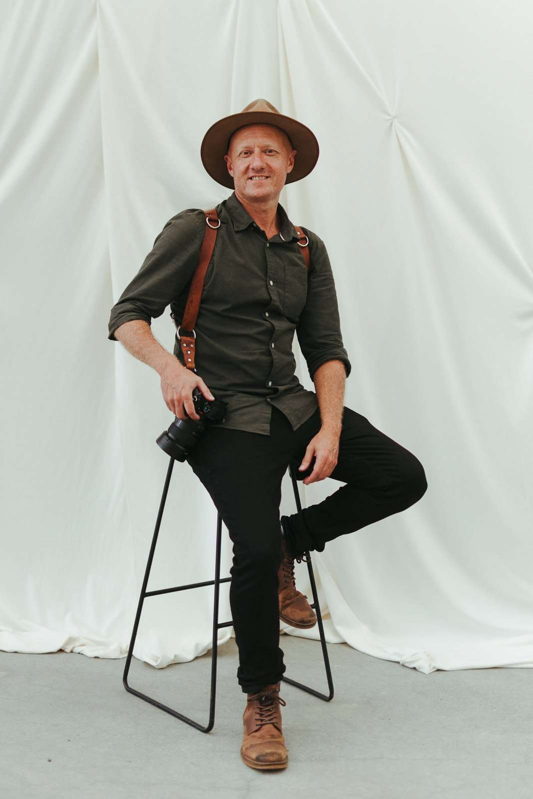 Graeme Passmore holding a camera at a wedding