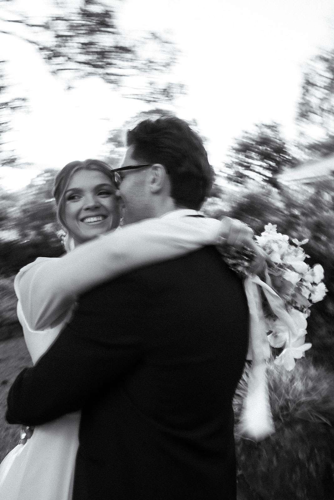 Bride and groom dancing with movement on their wedding day