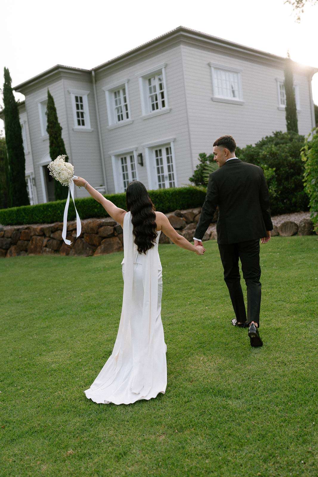 Bride and groom walking together after their wedding ceremony