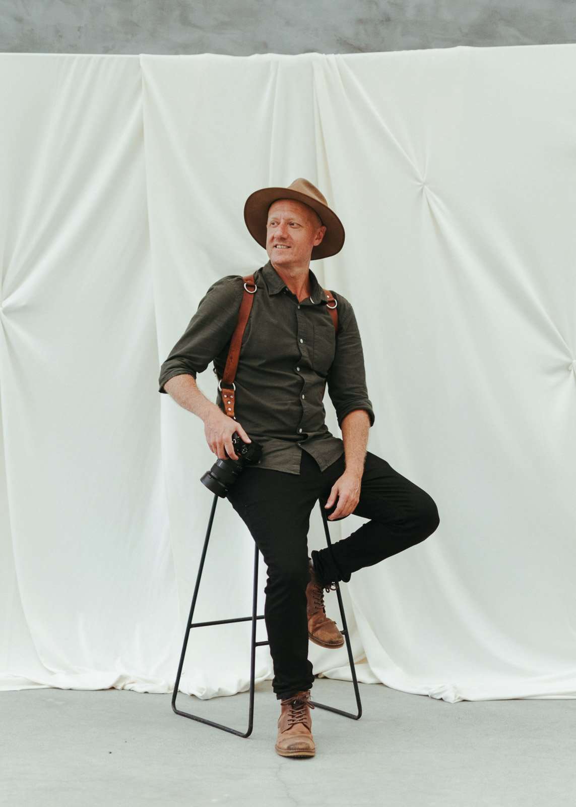 Gold Coast wedding photographer Graeme Passmore holding a camera