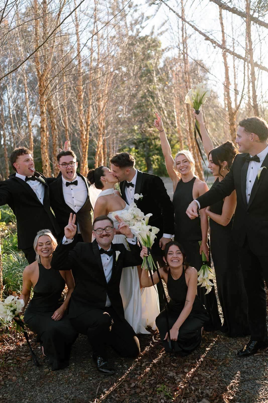 Bridal party celebrate together for a group photo