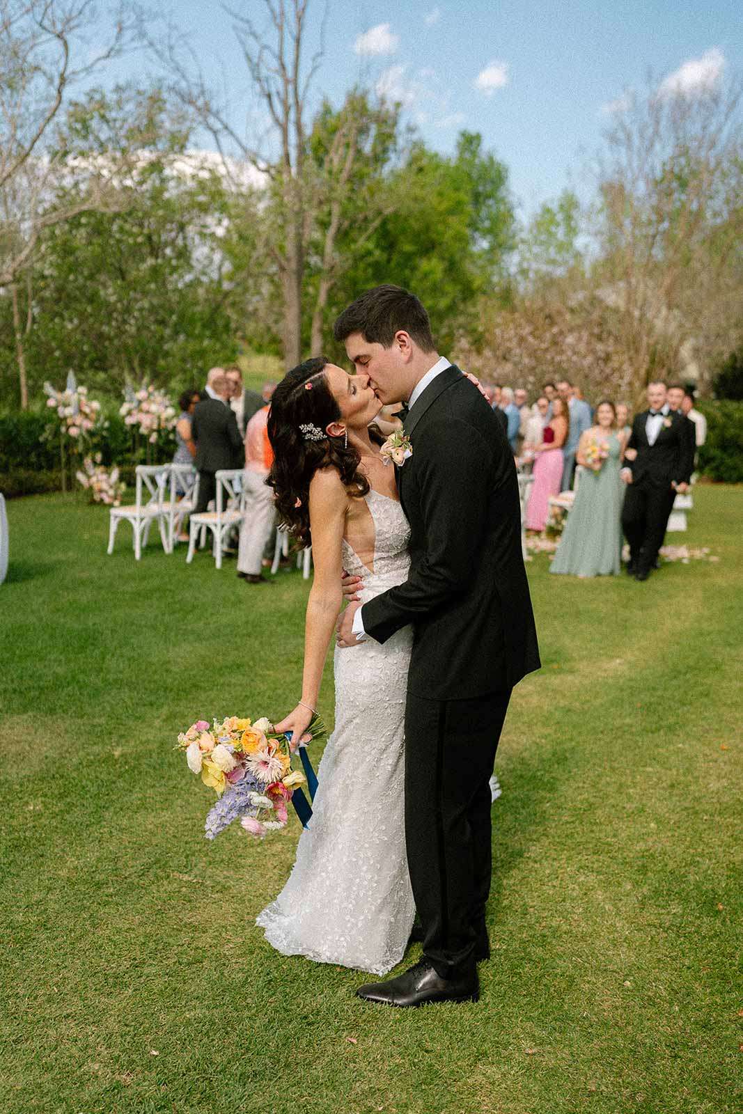 Bride and groom having their first kiss at Spicers Clovelly Estate