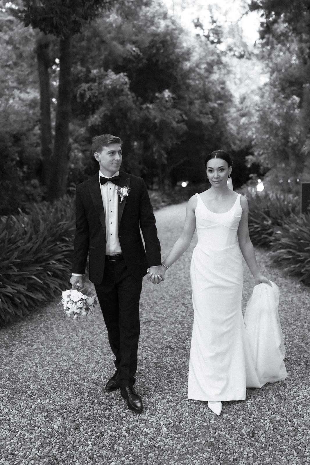 bride and groom pose for their editorial wedding portraits at gabbinbar